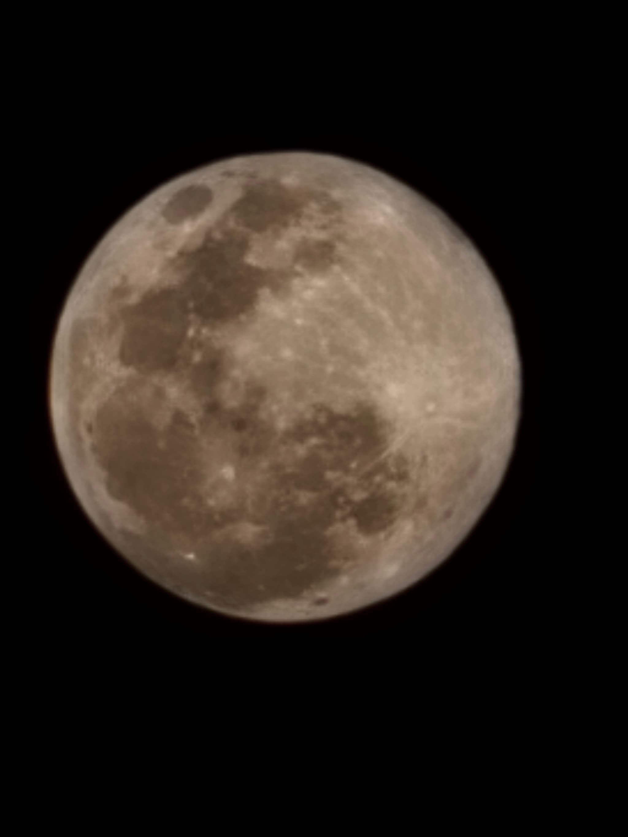 A full moon against a black night sky