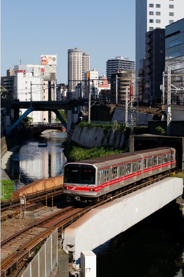 Tokyo train journey through urban landscapes #TravelJapan